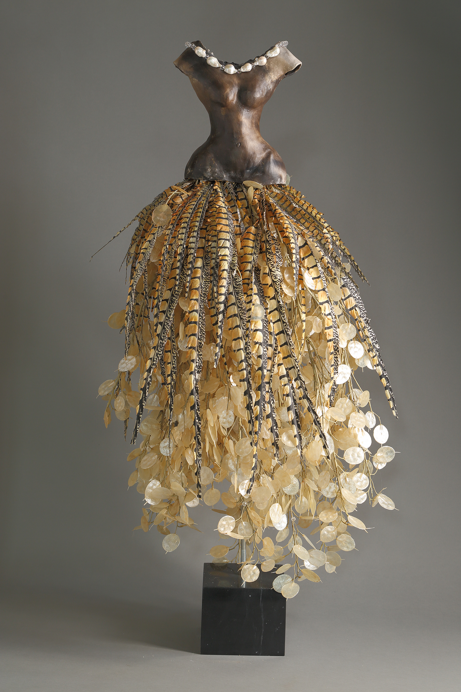 Estella Fransbergen - Sawdust Fired with Silver Dollar and Pheasant Feathers